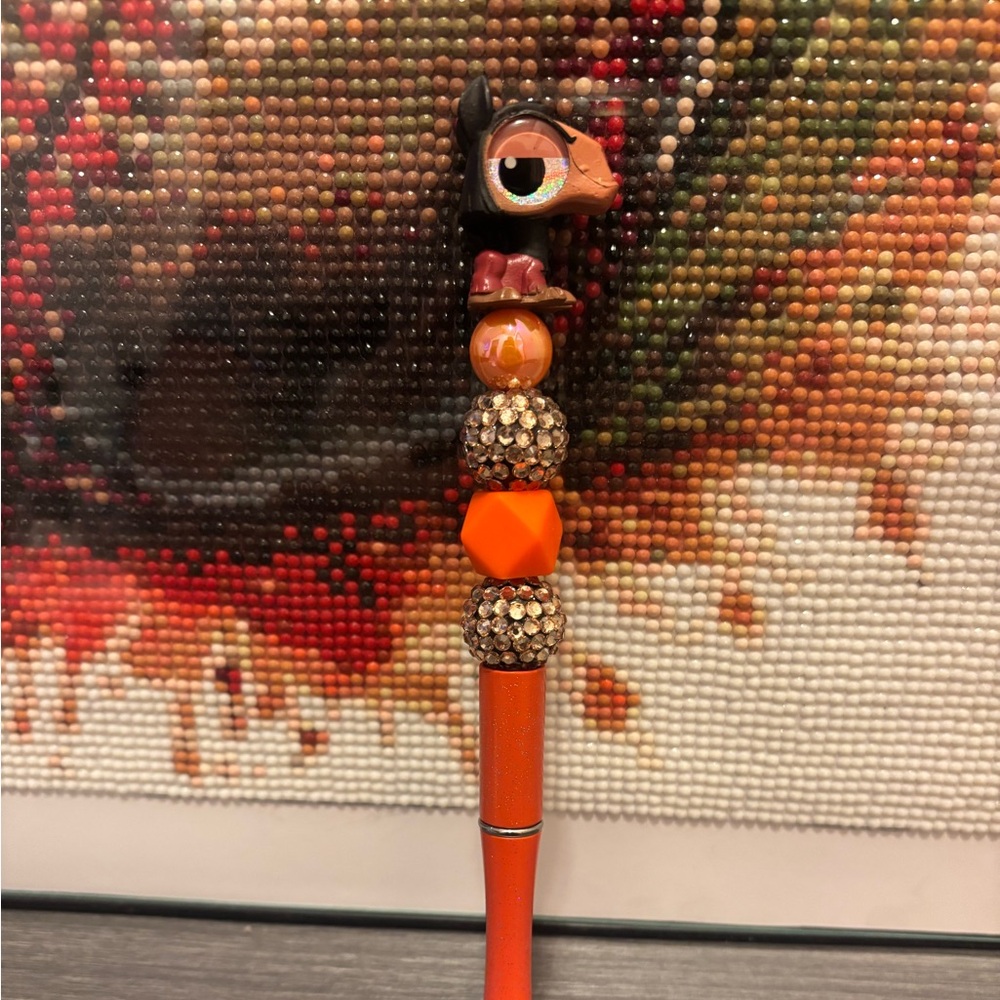 Decorative Orange and Black Pen with Kuzco topper